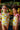 Girls wearing BANANO COLOMBIANO Wings Longsleeve swimsuits with banana print and shoulder ruffles.